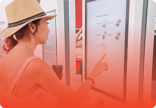 A customer places an order on the kiosk