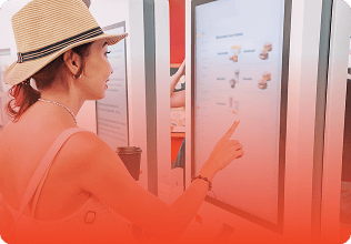 A customer places an order on the kiosk